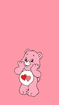 a pink teddy bear holding a heart in its paws on a pink background with the words i love you