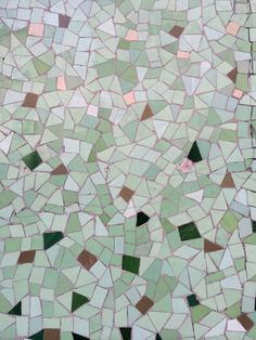 a close up view of a mosaic tile wall