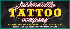 the jacksonville tattoo company logo on a black and green business card with an orange, yellow, and white design