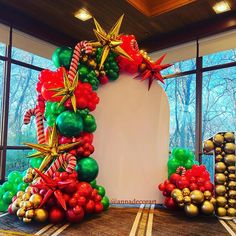 an arch made out of balloons and streamers