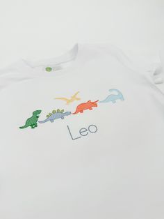 This simple and classic dinsosaur design is so fun!! Other color thread combinations available upon request! If you need girlier colors- just ask!  These shirts and blanks are high quality 100% combed cotton. Please select shirt size and style. IN NOTES TO SELLER BOX - Please type the name you want stitched below dinosaurs. If you do not want a name, type NO NAME.  You may add additional notes there as well!  Please message me with any questions. I am happy to help!  FREE SHIPPING! Dino Birthday Shirt, Embroidered Dinosaur, Dino Shirt, Dinosaur Shirt, Dino Birthday, Dinosaur Party, No Name, Birthday Shirt, Party Shirts