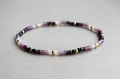 Black, Purple, White & Gold Bracelet - 3mm beads - stretchy I can make the bracelet to your size.  Just send me a message or you will receive a standard size (18cm) bracelet. Matching Couple Bracelets, Purple Beaded Bracelets, White Beads Bracelet, Homemade Bracelets, Bracelets Beaded, Black Beaded Bracelets, Diy Bracelet Designs, White Bracelets, White Gold Bracelet