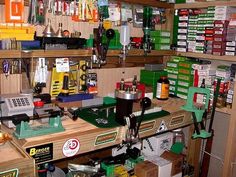 a workbench filled with lots of tools and other items on shelves in a store