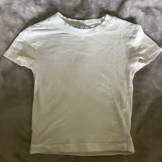 White H&M Baby Tee. Never Worn Basic Short Sleeve T-shirt By H&m, H&m Summer Shirt For Everyday Wear, Basic H&m Short Sleeve T-shirt, H&m Basic Short Sleeve T-shirt, H&m Classic Short Sleeve Tops, Basic H&m Tops For Everyday, Basic Everyday H&m Tops, H&m Cotton Short Sleeve Tops, Basic White Tops For Spring