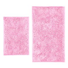 two pink bath mats on a white background