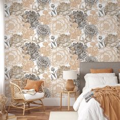 a bed room with a neatly made bed and a wallpapered flower pattern on the wall