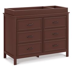 a brown dresser with six drawers and two doors