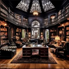 an elegant library with lots of bookshelves and couches in the middle of it