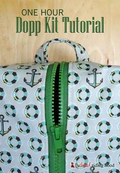 a white and green bag with an anchor pattern on it that says, one hour dopp kit tutor