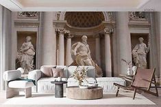 an elegant living room with statues on the wall