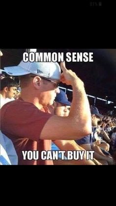 a man in a red shirt and white hat at a baseball game with the caption common sense you can't buy it