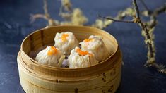 some food in a bamboo container on a table