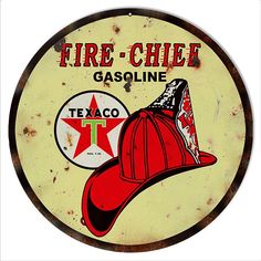 a fire - chief gasoline sign with a red hat on it's head and the words texco texas