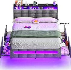 a bed with purple lights on the headboard and foot board, in front of a white background