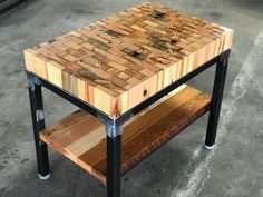 a wooden table sitting on top of metal legs