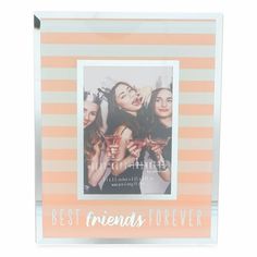 an orange and white striped frame with the words best friends forever on it in front of two girls holding martinis