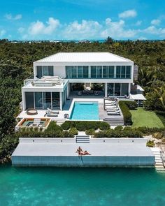 an aerial view of a house with a swimming pool