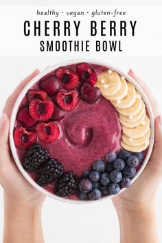 berry smoothie bowl with bananas, raspberries, and blueberries in it