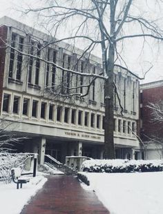 an old building with snow on the ground