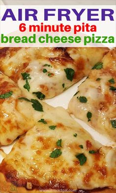 four pieces of pizza with cheese and parsley on top