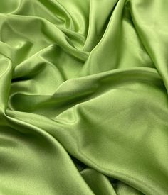 a close up view of a green fabric