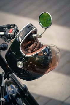 a close up of a motorcycle helmet with a mirror on the handlebars as seen from above