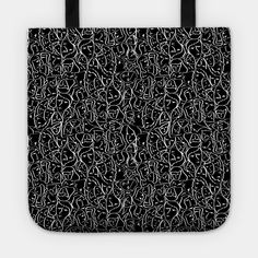 a black and white tote bag with an abstract design on the front, featuring small letters