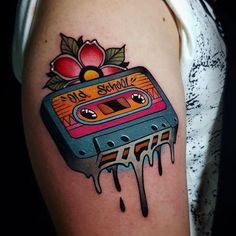 an old school tattoo with a cassette on it