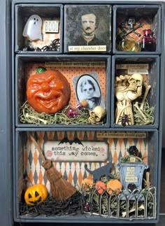 a shelf filled with lots of halloween decorations