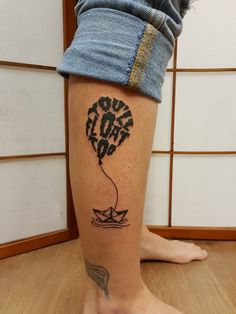 a person with a tattoo on their leg