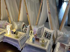 the tables are decorated with pillows and pictures