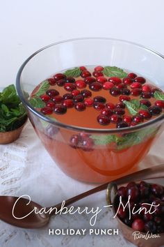 cranberry mint holiday punch in a glass bowl