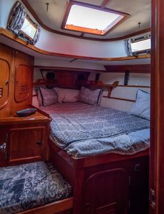 there is a bed in the cabin of a boat