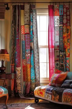 a living room filled with lots of colorful curtains and furniture in front of a window