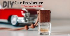 an old car is parked next to a small bottle of essential oils with the words diy car freshener written on it