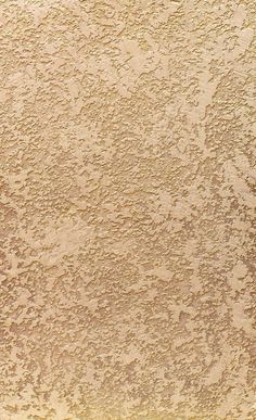 an orange and white surfboard sitting on top of a sandy beach