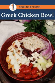 greek chicken bowl with tomatoes, onions, cucumbers and parmesan cheese