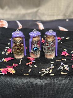 This listing is for one 2 mL glass Spell Jar Necklace w/ 18" or 24" silver chain of your choice.  Included with your Spell Jar: Customizable Charm (silver pentagram, bronze pentagram, or evil eye) Spell Jar Ingredients Wax Seal Anti-Anxiety- (*pictured*) Pink Salt, Lemon Balm, Vervain, Lavender, Rose Petals, Amethyst Chips, and sealed with Purple Wax. Used to ease anxiety and stress. Only high-quality herbs, wax, and crystals are used. Each necklace is handcrafted and unique with varying raw ingredients - no two are exactly the same. Meaning, item might vary slightly from what is pictured. My Products: The majority of the herbs, flowers, and plants I use are lovingly cultivated and harvested by me, using only heirloom and organic seeds to ensure the highest quality. For those I cannot grow Spell Jar Ingredients, Evil Eye Spell, Spell Jar Necklace, Jar Necklace, Spell Jar, Witch Spell, Baby Witch, Pagan Witchcraft, Modern Witch