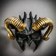 This Devil Mask With Curved Gold Horns Is Made From Plastic, Then Decorated And Hand Painted To Give It An Beautiful Black Texture Look. The Mask Is About 14" Tall And 14" Wide. The Masquerade Mask Will Make A Great Costume Accessory. Product Feature Made From Plastic With Plastic Plastered And Hand Crafted And Hand Painted. Great For A Masquerade Ball, Venetian Costume, Halloween Costume Features Mythological Beasts May Also Be Used As A Display Piece Hand Painted With An Unique Texture Finish Black Horned Masquerade Mask For Costume, Black Horned Masquerade Mask For Costume Party, Black Horned Masquerade Mask, Horned Black Masquerade Mask For Halloween, Mythological Beasts, Masquerade Mask Black, Venetian Costume, Mens Masquerade Mask, Devil Mask