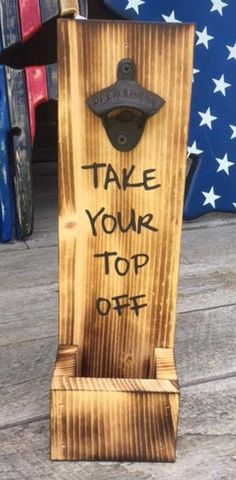 a wooden sign that says take your top off