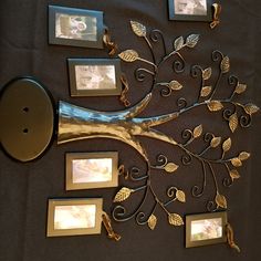 there is a metal tree with pictures on it