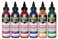 six bottles of different colors of paint on a white background with the words unicorn spirit in it