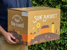 a man is holding a box that says sun basket down to no good on it