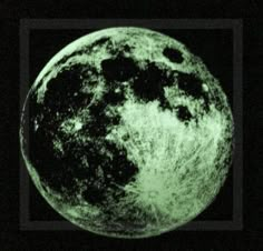 an image of the moon taken from space in black and green light, with dark background