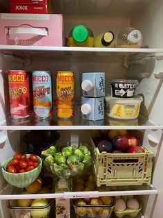 an open refrigerator filled with lots of different types of fruits and vegetables next to eggs