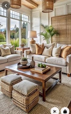 a living room filled with furniture and lots of windows