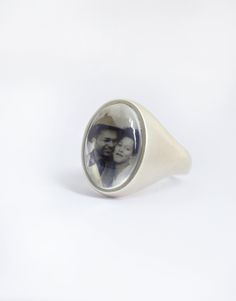 This bold larger style sterling silver ring with a smooth tapered comfort band is perfect for featuring your photo of your favorite person, animal, place etc....the options are endless!  This is the ring for you if you're looking for something with more of an impact and a little less delicate. Your photo will be framed within the 8x13mm oval setting then permanently sealed with both a layer of waterproof resin and a clear glass cabochon making this a very solid, sturdy and waterproof ring! You c 2023 Wishlist, Ashes Ring, Photo Ring, Oval Setting, February 2023, Photo Charms, Star Ring, Ring Sterling Silver, Favorite Person