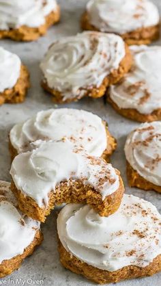 pumpkin spiced cookies with frosting on a baking sheet