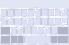 an image of a computer keyboard with sheep on the back and white squares around it