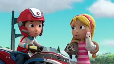 two children on a motorcycle talking to each other